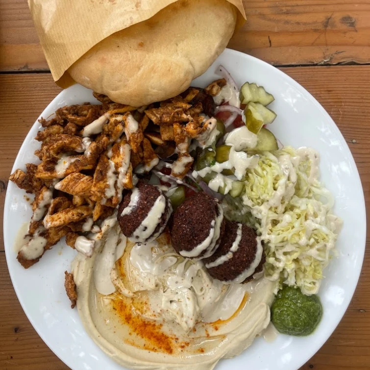 hummus plate with falafel and a pita