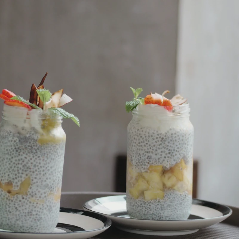 chia pudding breakfast snack with banana and yoghurt and fresh fruits tropical